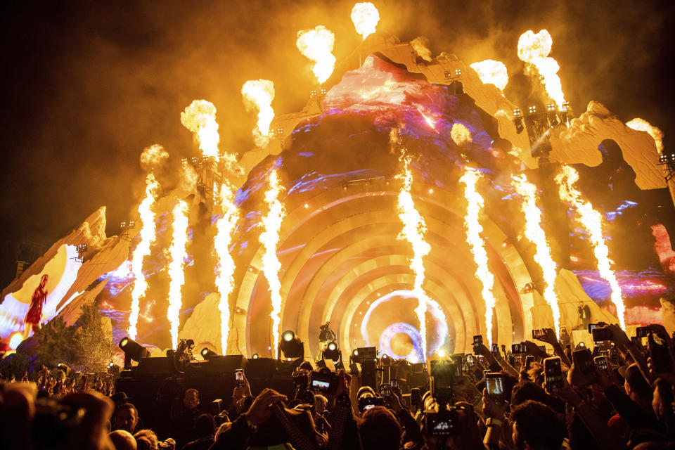 FILE - Travis Scott performs at Day 1 of the Astroworld Music Festival at NRG Park on Nov. 5, 2021, in Houston. The families of two people who died during last year's deadly festival have settled wrongful death lawsuits they had filed, according to attorneys. (Photo by Amy Harris/Invision/AP, File)