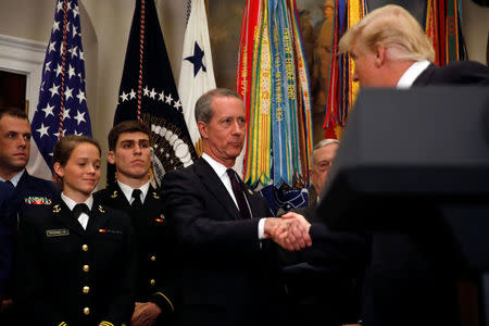 U.S. President Donald Trump shakes hands with Rep. Mac Thornberry (R-TX) during the signing ceremony for the National Defense Authorization Act for Fiscal Year 2018 at the White House in Washington D.C., U.S. December 12, 2017. REUTERS/Carlos Barria