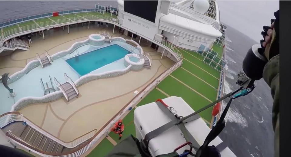 In this image from video, provided by the California National Guard, airmen with the 129th Rescue Wing drop coronavirus testing kits down to the Grand Princess cruise ship off the coast of California on March 5, 2020.