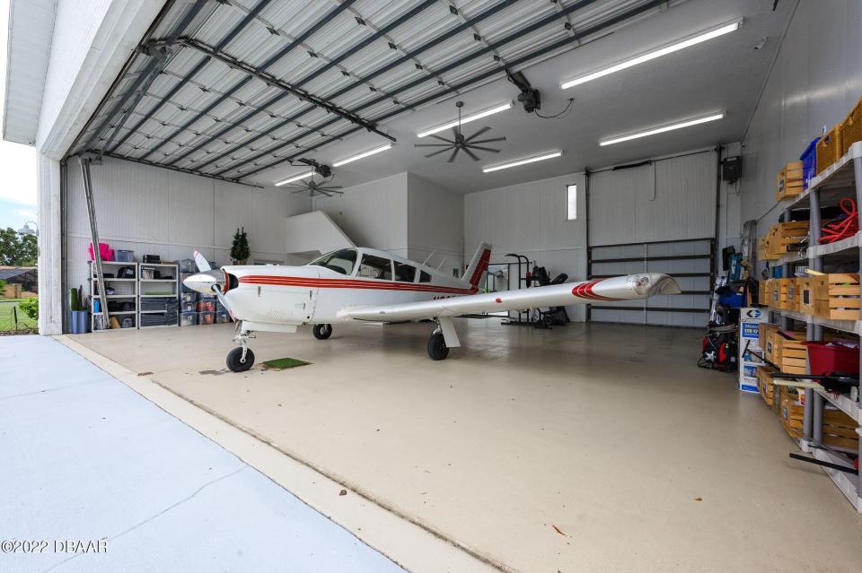 The 37-foot-by-46-foot hangar, which sits close to the runway, has an opening of almost 14 feet high and 42 feet wide and includes a full bath as well as office space.