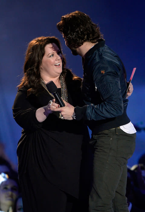 Bradley Cooper accepts the Best Male Performance award from Melissa McCarthy for “Silver Linings Playbook”.