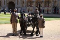 <p>A horse and carriage does a lap of the Quadrangle, in tribute to Prince Philip’s love of carriage driving. </p>