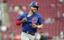 Chicago Cubs' Patrick Wisdom runs the bases after hitting a three-run home run against the Cincinnati Reds during the fourth inning of a baseball game in Cincinnati, Monday, May 23, 2022. (AP Photo/Paul Vernon)