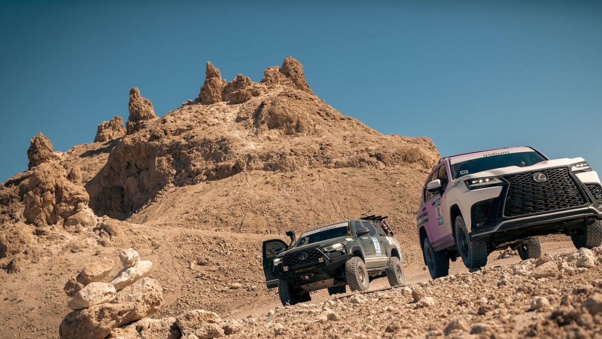 two cars parked on a rocky hill