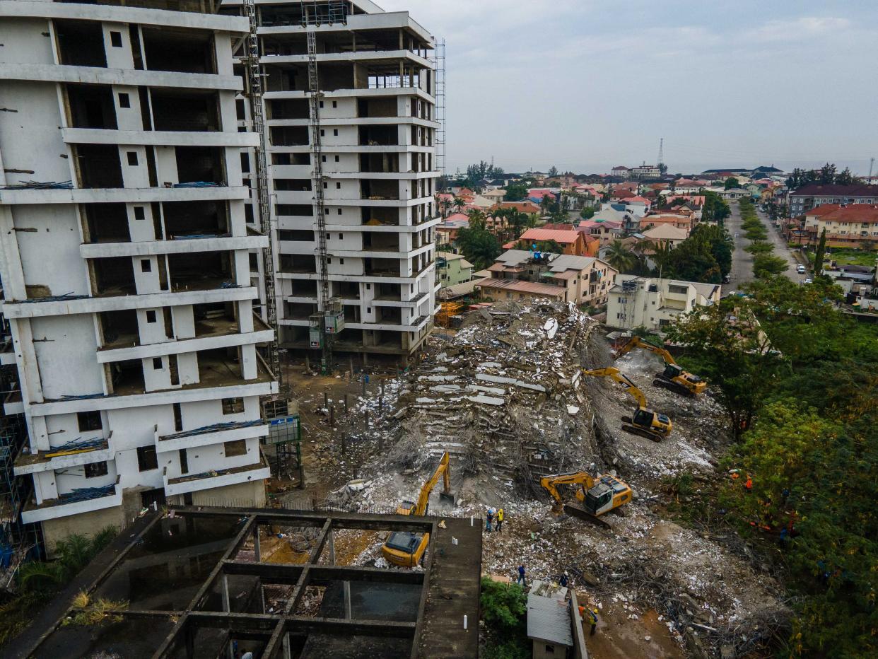 The 21-story building was under construction when it fell abruptly into a pile of concrete slabs on Monday in the wealthy Ikoyi district of Nigeria's commercial capital. 