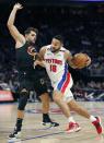 Detroit Pistons guard Cory Joseph (18) drives to the basket against Cleveland Cavaliers guard Raul Neto during the first half of an NBA basketball game Sunday, Nov. 27, 2022, in Detroit. (AP Photo/Duane Burleson)