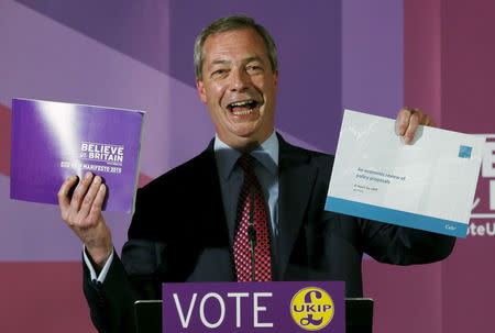 Britain's United Kingdom Independence Party (UKIP) leader Nigel Farage unveils his party's manifesto in Aveley, southeast England April 15, 2015. REUTERS/Cathal McNaughton