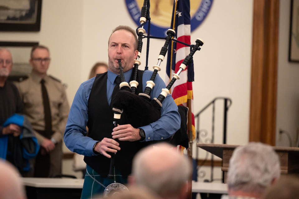 Bagpiper Nathan Wilds plays “Amazing Grace” at a small ceremony to honor fallen serviceman LtC Nick Goshen and for the dedication of the Veterans Tribute Garden flagpole in his honor. The dedication ceremony was held on Veterans Day at Silver Lake Village Hall.