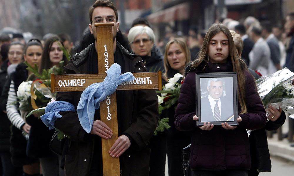 Mourners accompany the coffin of Kosovo Serb politician Oliver Ivanović in Mitrovica