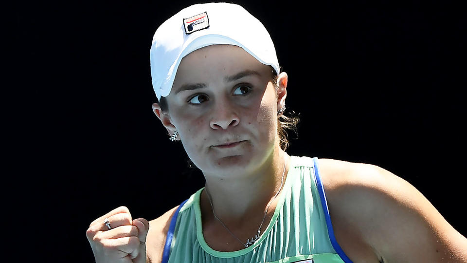 Ashleigh Barty fist pumps after a point Czech Republic's Petra Kvitova.