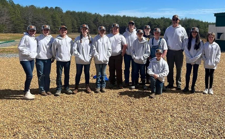 The Apple Valley Middle School Rifle and Archery Team pose after its two top-three finishes at the district tournament in Columbus. From left to right are Aadison Lindsey, Cora Case, Xander Sorenson, Caitlyn Murphy, Karlie Laughter, Brodie McHone, Elijah Reaves, Evan Fortin, Samu Miller, Tristan Isaacs, Isaac Goode, Rick Garren- Coach, Danica Garren and Cailyn Case. Team members not pictured are Blake Wilson, Meadow Guidash, Sam Tondra and Skylar Gorter.