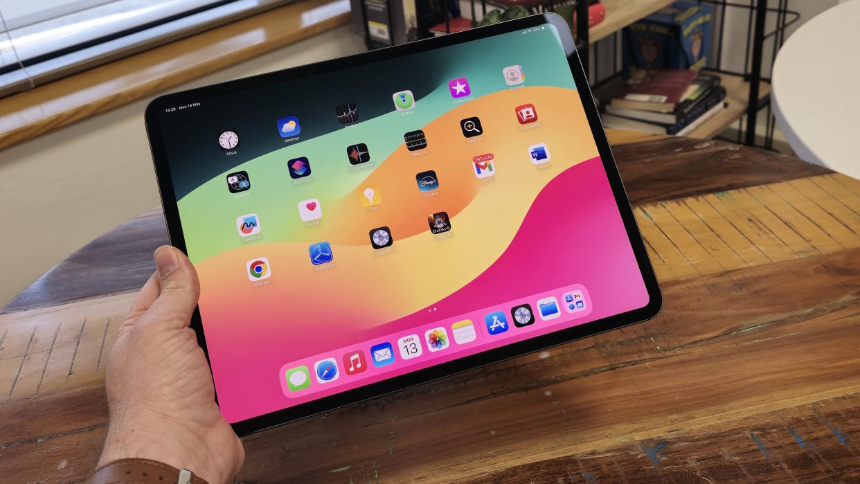  IPad Pro 13-inch with M4 chip on a wooden table. 