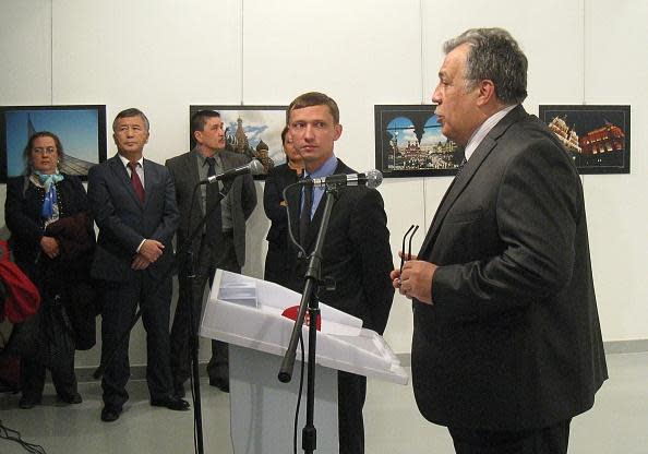 <p>Andrey Karlov (R), the Russian ambassador to Turkey, gives a speech before being shot by a gunman (unseen) during an art exhibition in Ankara. Photo: UGUR KAVAS/AFP/Getty Images</p>