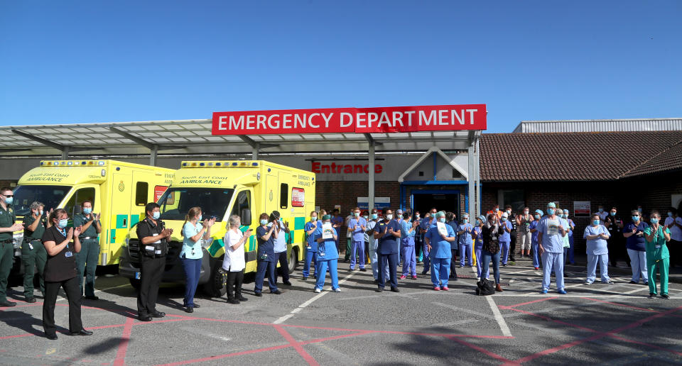 NHS staff outside the William Harvey Hospital in Ashford, Kent, join in the pause for applause to salute the NHS 72nd birthday.