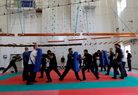 Israeli police recruits take part in physical training at Israeli police academy center in Beit Shemesh, Israel August 24, 2016. Picture taken August 24, 2016. REUTERS/Ammar Awad