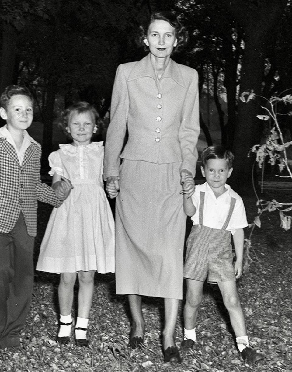 Dorothy Van Zandt takes time out from planning a Colonial Country Club dance, with son Townes Van Zandt, right, daughter Donna and a friend’s son, Hard Floore Jr.