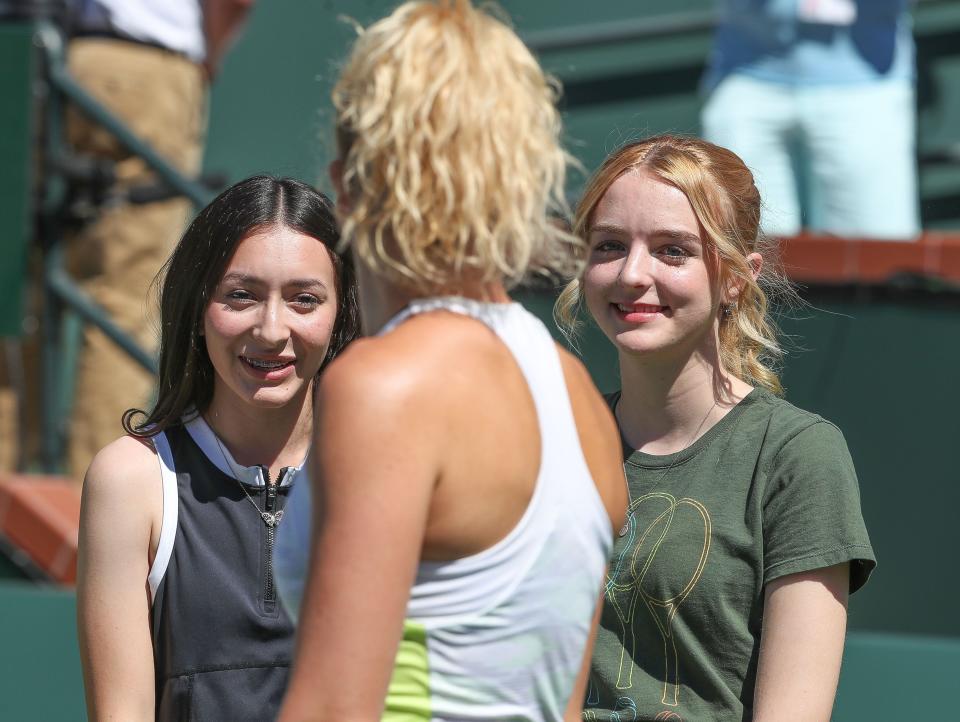 Stephanie De La Rosa, left, and Caitlyn Hill chat with Katerina Siniakova when the two Desert Mirage students were awarded with a scholarship during the BNP Paribas Open in Indian Wells, Calif., Mar. 18, 2023. 