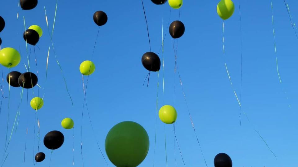 Balloons float skyward during a balloon release held by the education advocacy group Parent Shield Fort Worth. The group held the event to demand better reading outcomes.