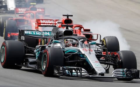 Mercedes driver Lewis Hamilton, of Britain, leads the race, followed by Ferrari driver Sebastian Vettel, of Germany, after the start of the Brazilian Formula One Grand Prix at the Interlagos race track in Sao Paulo, Brazil, Sunday, Nov. 11, 2018 - Credit: AP