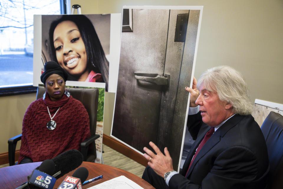 Attorney Geoffrey Fieger, right, and Tereasa Martin, left, mother of Kenneka Jenkins show evidence pictures as they talk about lawsuit against the Crowne Plaza hotel at a press conference in Chicago on Tuesday, Dec.18, 2018. Fieger represents the family of Jenkins who was found dead in a walk-in freezer. (Zbigniew Bzdak/Chicago Tribune via AP)