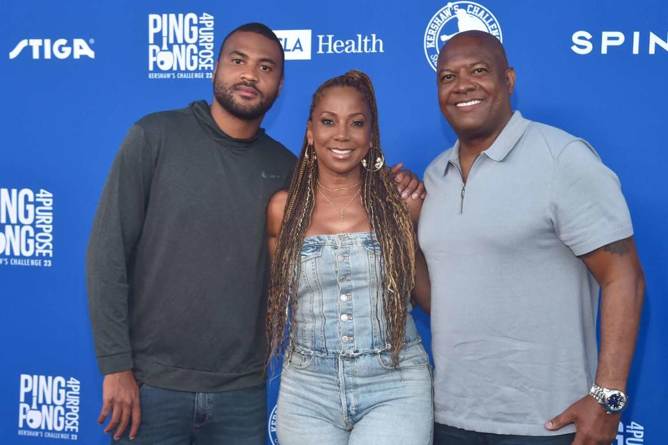 <p>Alberto E. Rodriguez/Getty</p> Holly Robinson Peete with son RJ (left), and husband Rodney Peete.