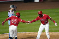 Los Angeles Angels' Justin Upton, right, celebrates his grand slam at home plate with Luis Rengifo during the seventh inning of a baseball game against the Minnesota Twins Friday, April 16, 2021, in Anaheim, Calif. (AP Photo/Marcio Jose Sanchez)