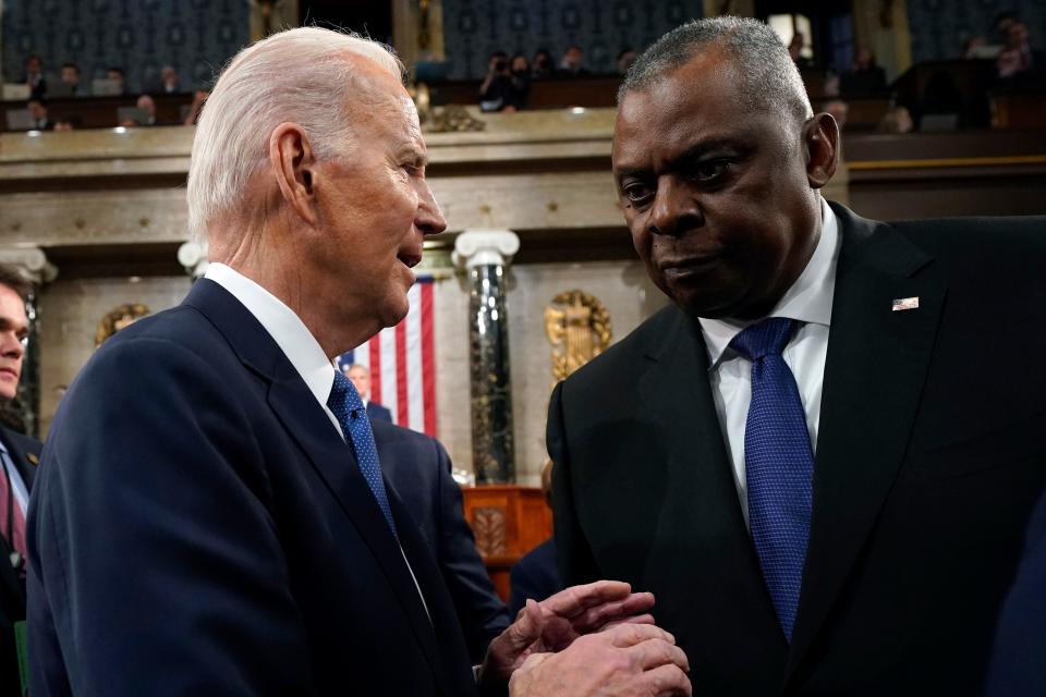 President Joe Biden talks with Defense Secretary Lloyd Austin after the State of the Union address to a joint session of Congress at the Capitol, Tuesday, Feb. 7, 2023, in Washington. (Jacquelyn Martin, Pool)