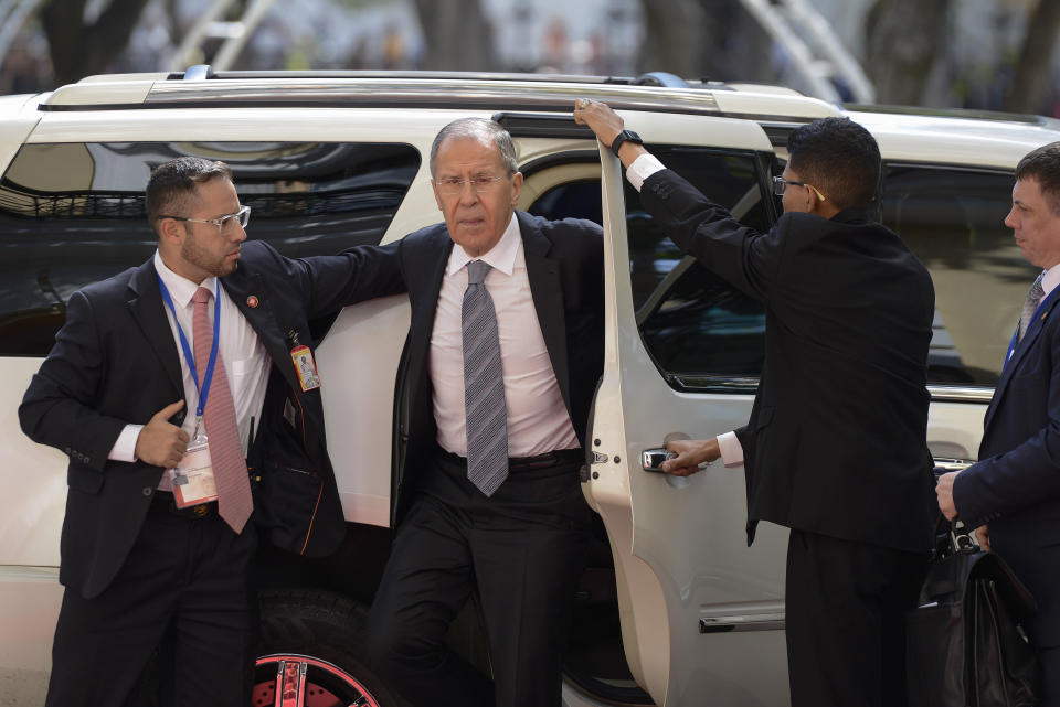 Russia's Foreign Minister Sergey Lavrov, center, arrives to meet with Venezuela's Foreign Minister Jorge Arreaza at the Foreign Ministry in Caracas, Venezuela, Friday, Feb. 7, 2020. (AP Photo/Matias Delacroix)