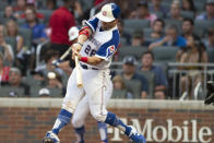 Atlanta Braves' Stephen Vogt hits a single during the second inning of a baseball game against the Milwaukee Brewers, Saturday, July 31, 2021, in Atlanta. (AP Photo/Hakim Wright Sr.)