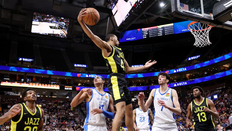 Utah’s Taevion Kinsey grabs a rebound over Oklahoma City’s Tre Mann and Chet Holmgren as the Jazz and Thunder play in Summer League action at the Delta Center in Salt Lake City on Monday, July 3, 2023. Jazz lose 95-85.