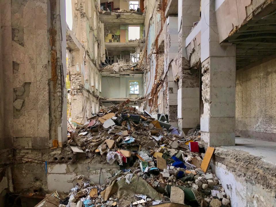 local and international volunteers support the resistance against the russian military in ukraine a destroyed government building in mykolaiv