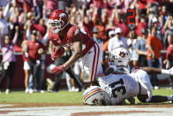 Arkansas running back Dominique Johnson (20) pushes past Auburn defensive back Chandler Wooten (31) to score a touchdown during the second half of an NCAA college football game, Saturday, Oct. 16, 2021, in Fayetteville, Ark. (AP Photo/Michael Woods)