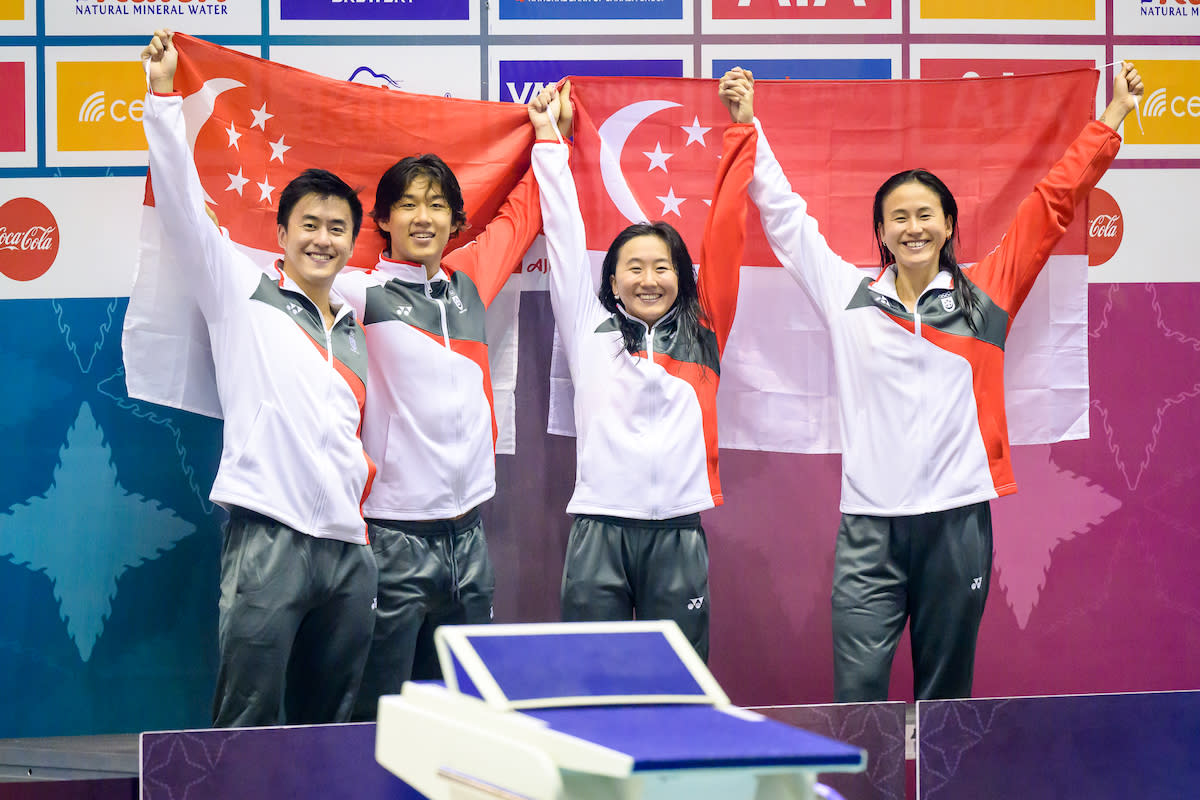 Singapore swimmers (from left) Quah Zheng Wen, Nicholas Mahabir, Quah Jing Wen and Quah Ting Wen celebrate after winning gold in the mixed 4x100m medley relay at the 2023 SEA Games. (PHOTO: SNOC/Andy Chua)