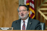 Chairman Sen. Gary Peters, D-Mich., speaks during a Senate Governmental Affairs Committee hybrid nominations hearing on Capitol Hill in Washington, Thursday, April 22, 2021, to consider the nominees for Postal Service Governors Anton Hajjar, Amber McReynolds, and Ronald Stroman, along with Kiran Ahuja, the nominee to be Office of Personnel Management Director. (AP Photo/Andrew Harnik)