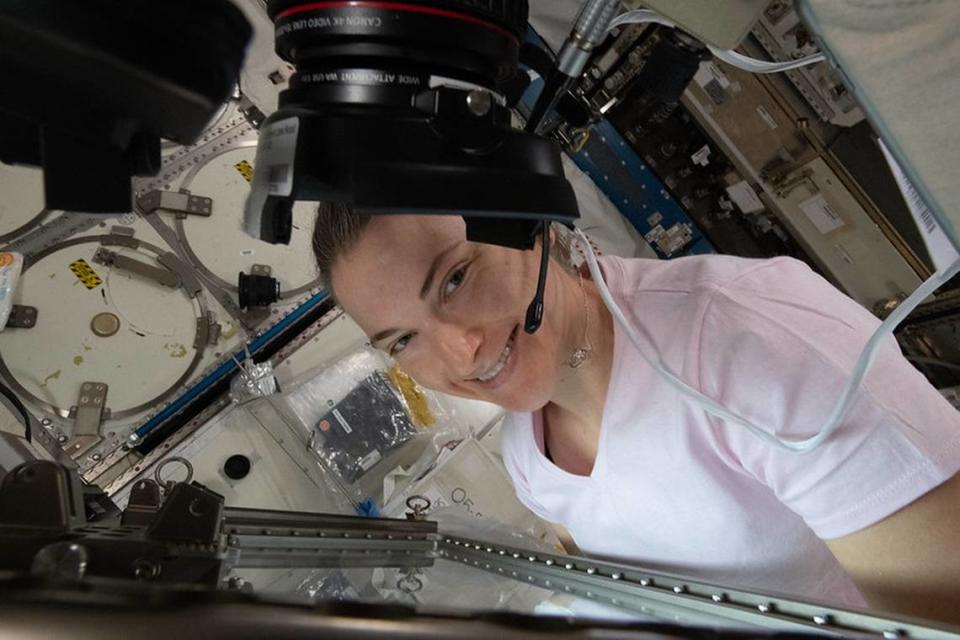 NASA astronaut Kayla Barron works inside the International Space Station’s Life Science Glovebox conducting botany research looking at the genetic architecture of plant regeneration in space.