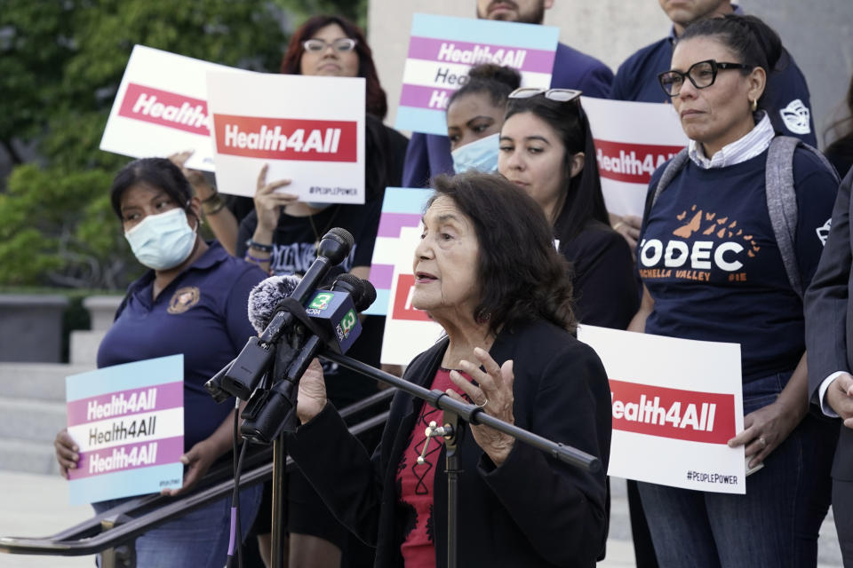 Civil rights activist Dolores Huerta speaks in support of health care for all low-income immigrants living in the country illegally during a rally at the Capitol Sacramento, Calif., on Wednesday, June 29, 2022. Gov. Gavin Newsom is expected to sign a $307.9 billion operating budget on Thursday June 30, 2022, that makes all low-income adults eligible for the state's medicaid program regardless of their immigration status. (AP Photo/Rich Pedroncelli)