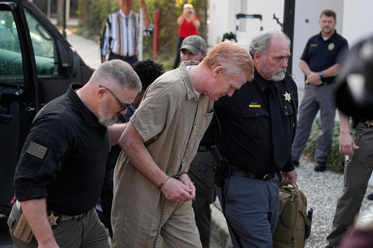 Alex Murdaugh is led to the Colleton County Courthouse by sheriff's deputies for sentencing in in Walterboro, Friday, 3 March 2023 (AP)