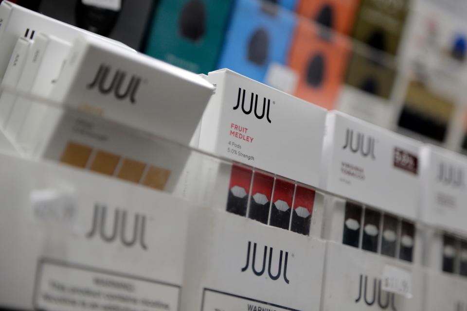 Juul products are displayed at a smoke shop in New York. E-cigarette use is increasing among teens in Rhode Island, according to a new report by Rhode Island Kids Count.