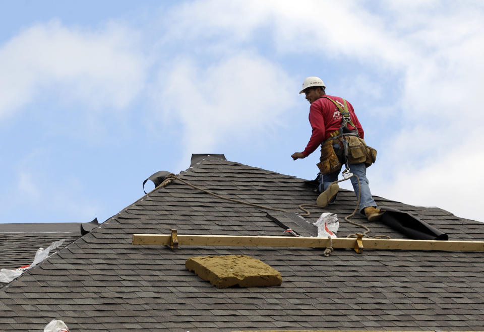 In this Friday, Oct. 12, 2012, photo, a construction worker finishes a roof in Chicago. Confidence among U.S. homebuilders is at its highest level in six years in October, reflecting improved optimism over the strengthening housing market this year and a pickup in visits by prospective buyers to builders’ communities. (AP Photo/Nam Y. Huh)