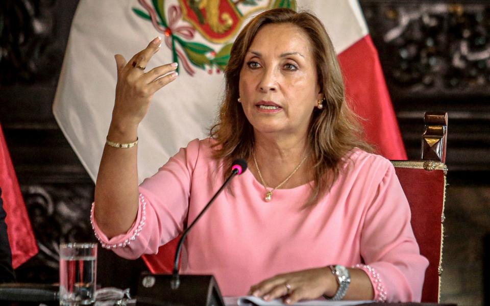 Peru's President Dina Boluarte gestures during a press conference at the government palace after her statement to the prosecutor's office