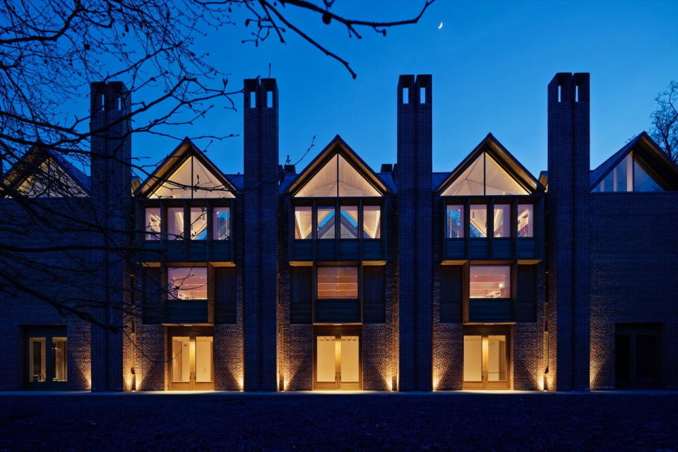 Nighttime view of the Níall McLaughlin-designed New Library at Magdalene College in Cambridge, UK.