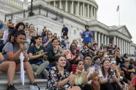 Crowds that attended a sit-in at Capitol Hill listen to Rep. Cori Bush, D-Mo., after it was announced that the Biden administration will enact a targeted nationwide eviction moratorium outside of Capitol Hill in Washington on Tuesday, August 3, 2021. For the past five days, lawmakers and activists primarily led by Rep. Cori Bush, D-Mo., have been sitting in on the steps of Capitol Hill to protest the expiration of the eviction moratorium. (AP Photo/Amanda Andrade-Rhoades)