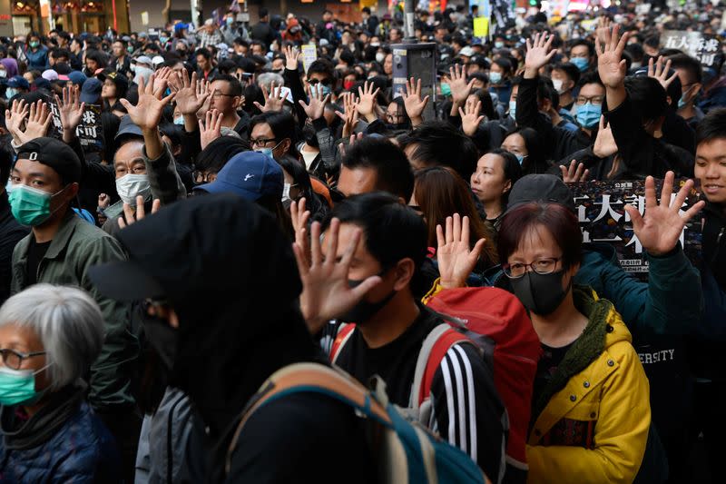 People attend a Human Rights Day march