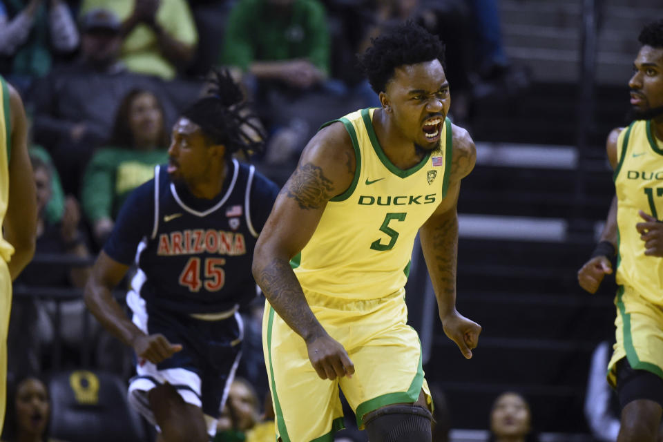 Oregon guard Jermaine Couisnard (5) reacts after making a shot against against Arizona during the second half of an NCAA college basketball game Saturday, Jan. 14, 2023, in Eugene, Ore. (AP Photo/Andy Nelson)