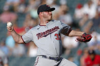 Minnesota Twins starting pitcher Dylan Bundy throws to a Cleveland Guardians batter during the first inning of a baseball game Wednesday, June 29, 2022, in Cleveland. (AP Photo/Ron Schwane)