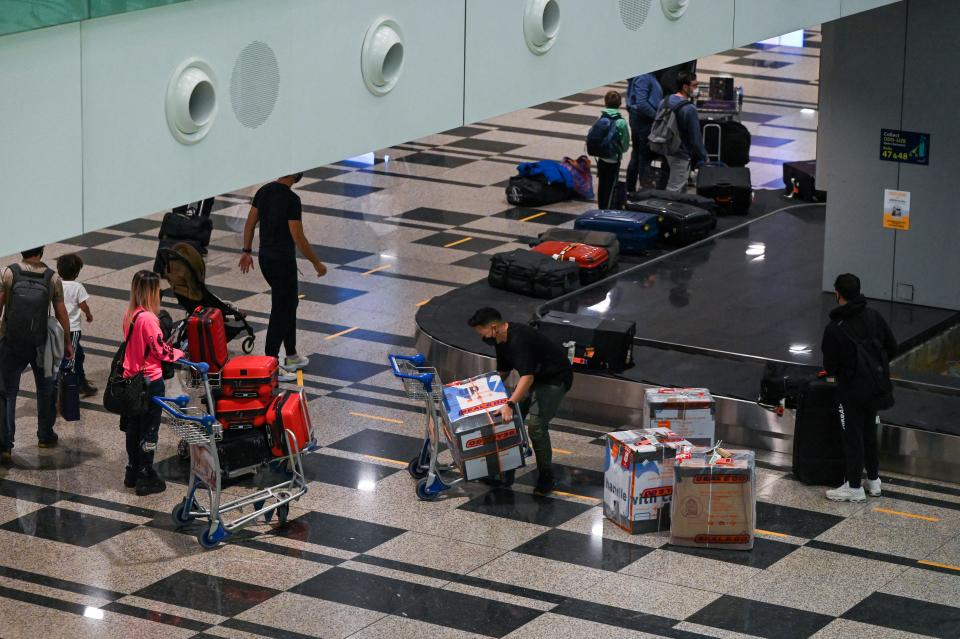 Passengers arriving at Changi Airport in Singapore.