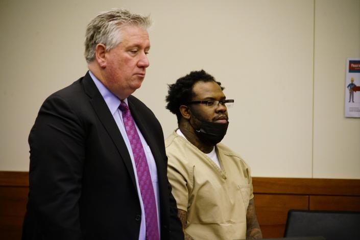 Jamie L. Cason, 27, right, appeared in Franklin County Common Pleas Court with his defense attorney Mark Collins, left, to plead guilty Wednesday to promoting prostitution and other crimes.