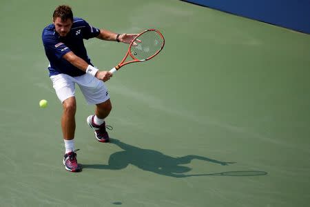 Sep 3, 2015; New York, NY, USA; Stan Wawrinka of Swizterland hits a backhand against Hyeon Chung of Korea (not pictured) on day four of the 2015 U.S. Open tennis tournament at USTA Billie Jean King National Tennis Center. Wawrinka won 7-6 (2), 7-6 (4), 7-6 (6). Mandatory Credit: Geoff Burke-USA TODAY Sports / Reuters Picture Supplied by Action Images