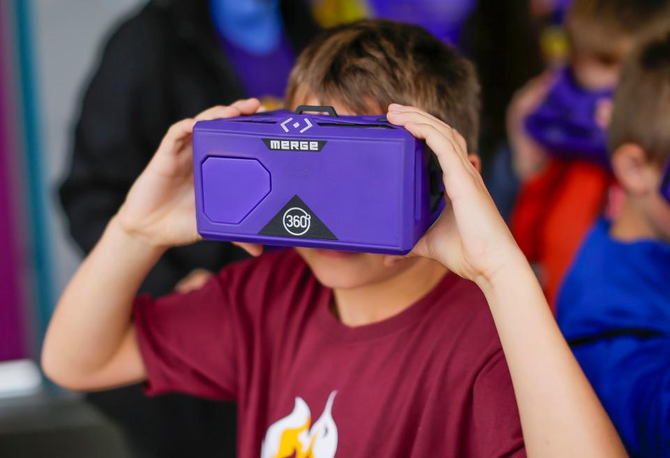 Jaxon Bushman, 8, of St. Paul in Millersville checks out virtual reality goggles during Sheboygan STEAMfest at UW-Green Bay, Sheboygan campus, Thursday, October 12, 2023, in Sheboygan, Wis.