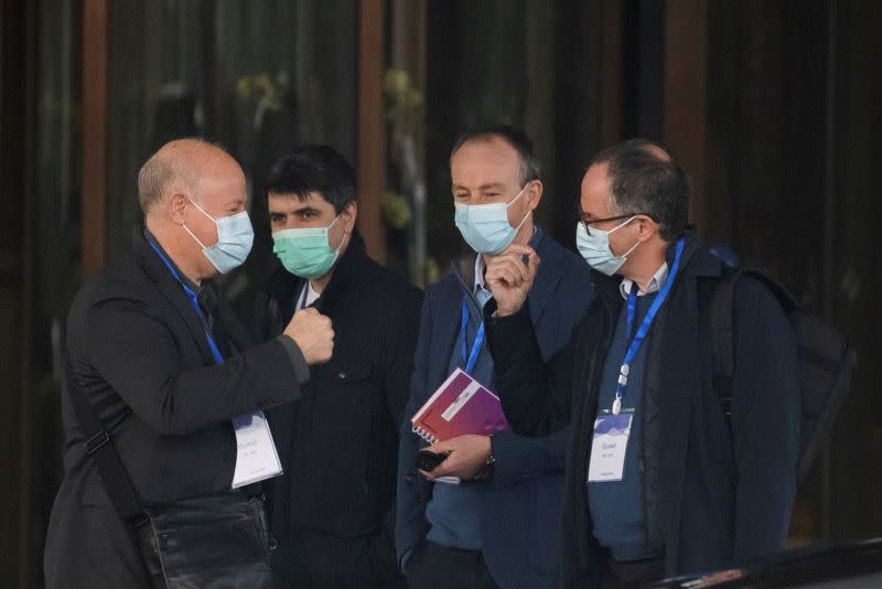 Members of the World Health Organization team, tasked with investigating the origins of the coronavirus disease (COVID-19), leave their hotel in Wuhan